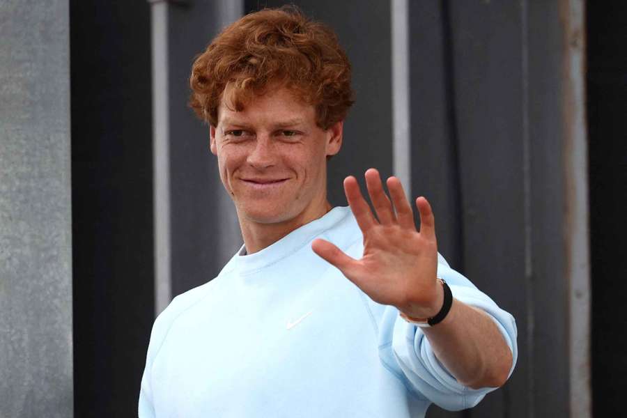 Italy's Jannik Sinner waves towards fans after his press conference in Rome