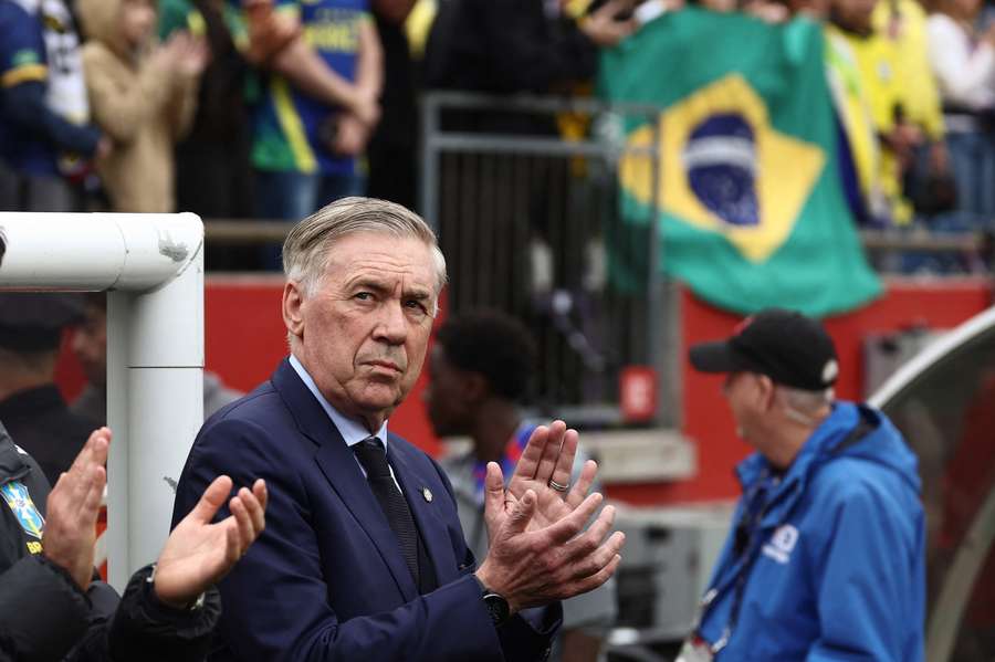Carlo Ancelotti applauds fans during Brazil's defeat to France