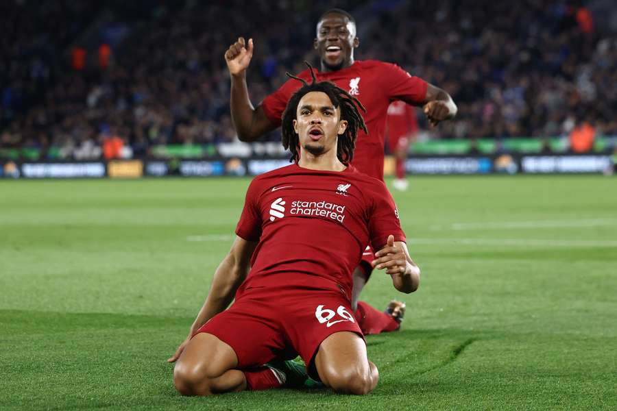 Liverpool's English defender Trent Alexander-Arnold (C) celebrates after scoring his team third goal