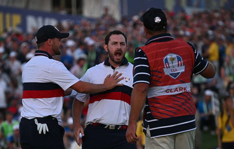 Patrick Cantlay celebrates after holing his birdie putt to win the hole and the match on the 18th green