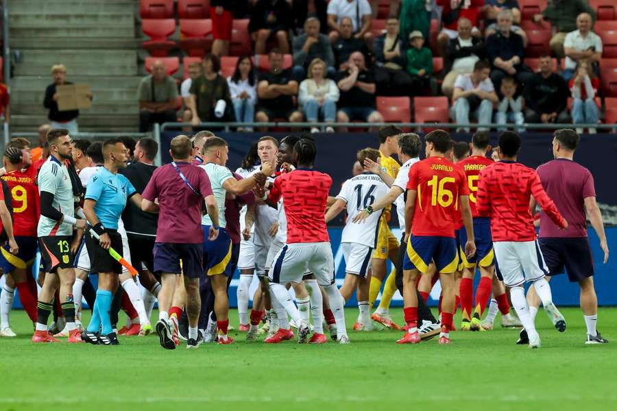 England and Spain's players square up following the final whistle