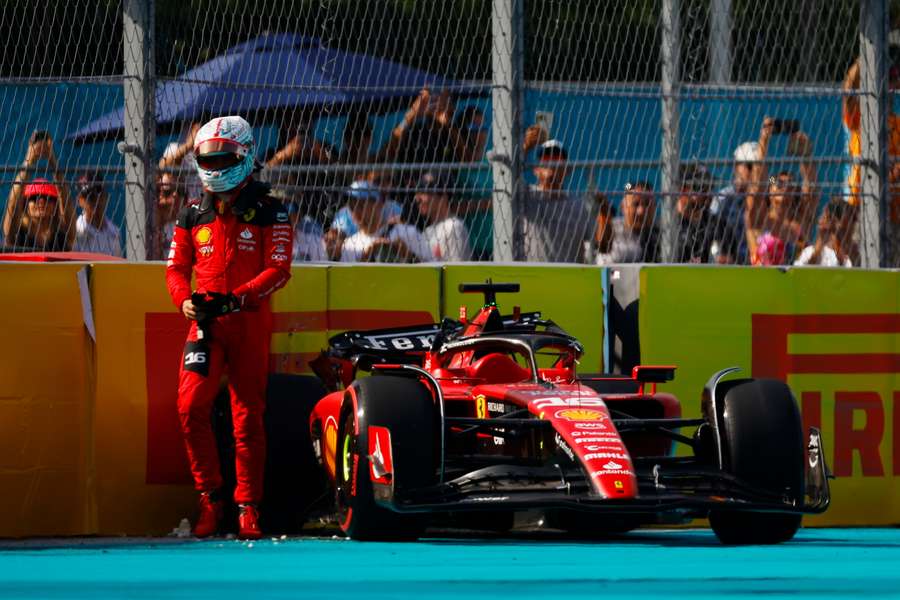 Charles Leclerc of Ferrari walks from his car after crashing during qualifying