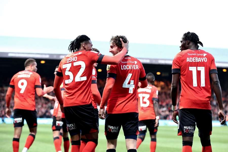 Luton's players celebrate their play-off win against Sunderland
