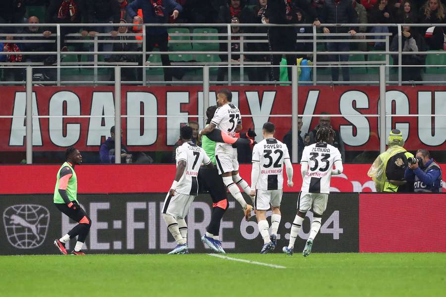 Udinese celebrate their winner in Milan