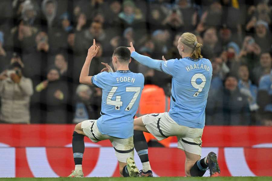 Foden and Haaland celebrate after the midfielder's goal