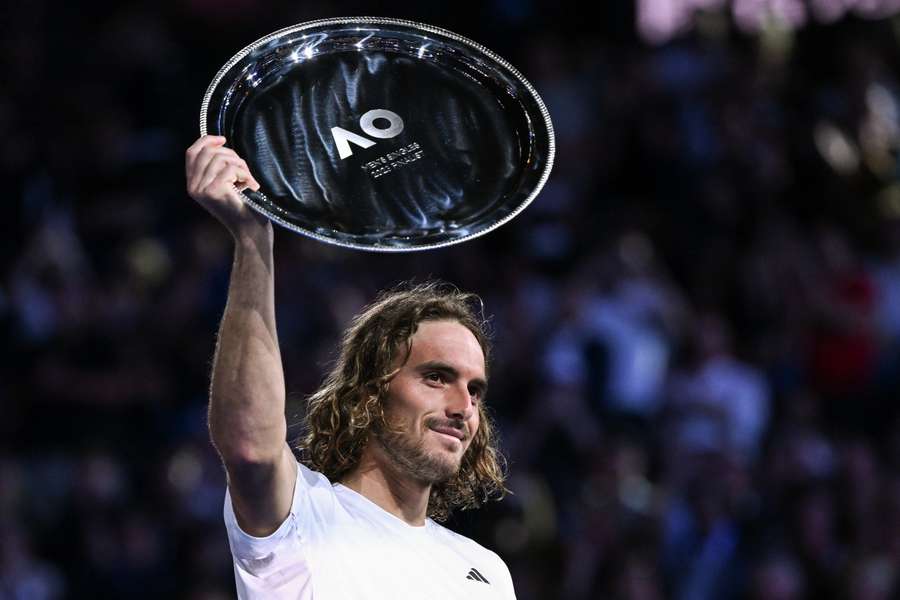 Tsitsipas poses with the runners-up shield