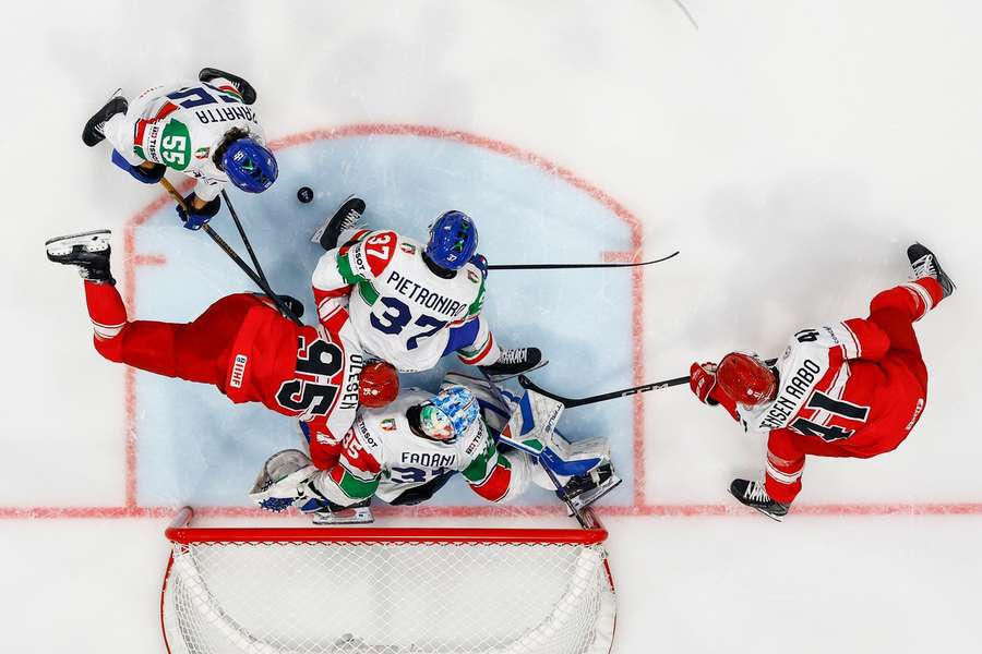 Denmark's Nick Olesen, left, and Denmark's Jesper Jensen Aabo, right, challenge Italy's Luca Zanatta, top left, Italy's Phil Pietroniro, top center Denmark's Nick Olesen, left, and Denmark's Jesper Jensen Aabo, right, challenge Italy's Luca Zanatta, top left, Italy's Phil Pietroniro, top center