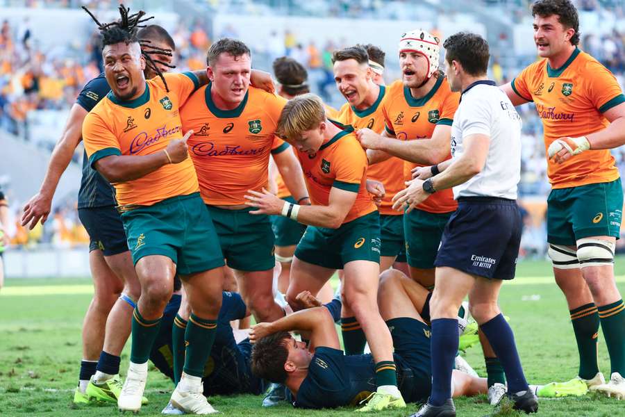 Angus Bell (second left) celebrates his game-winning try during the Rugby Championship Test between Australia and Argentina