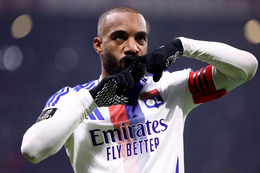 Lacazette celebrates scoring his opening goal against Nice
