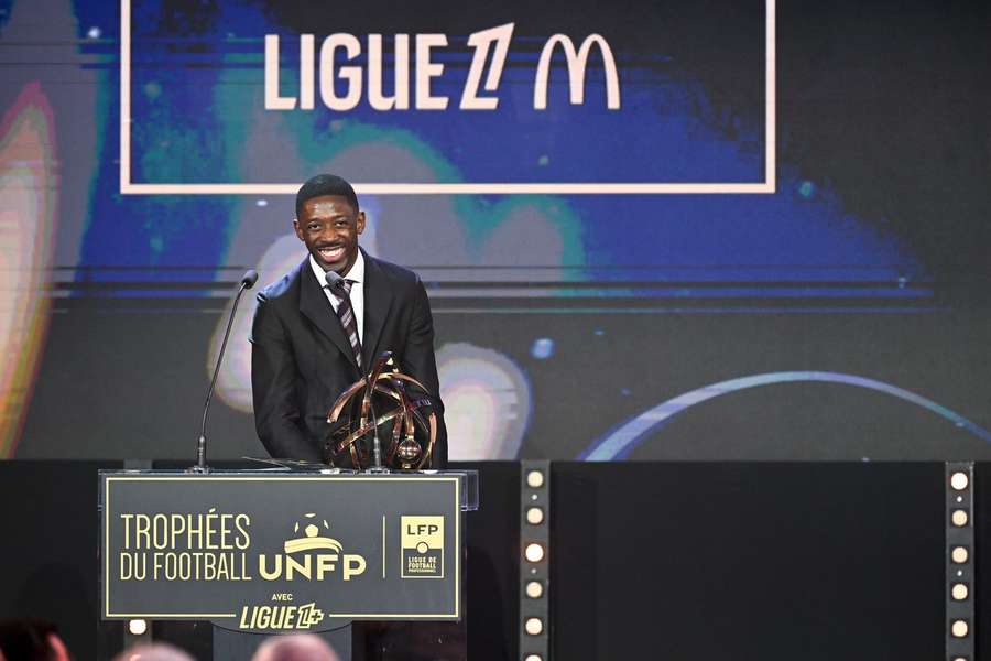 Ousmane Dembele with his player of the year trophy