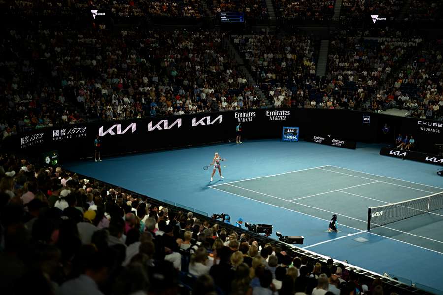 The crowd watches on as Azarenka returns her opponent's serve