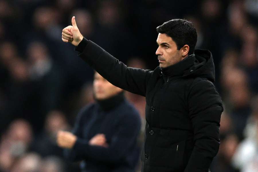 Arteta applauds his team during the first half