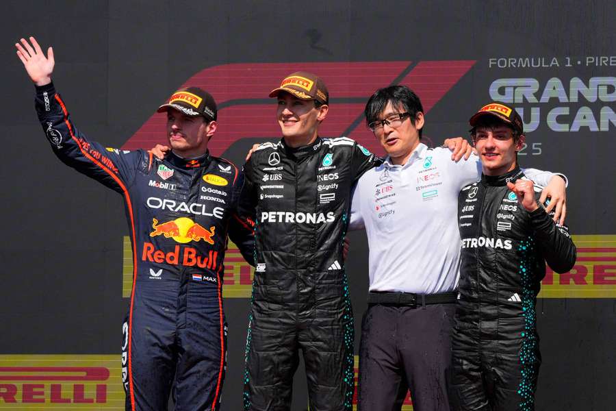 Russell (second left) poses after the race