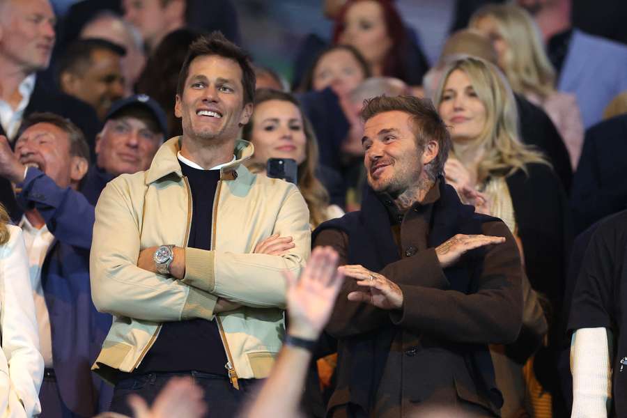 Tom Brady (l) in the stands with David Beckham