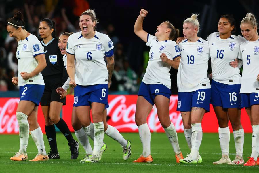 England's players celebrate their victory after a penalty shootout against Nigeria