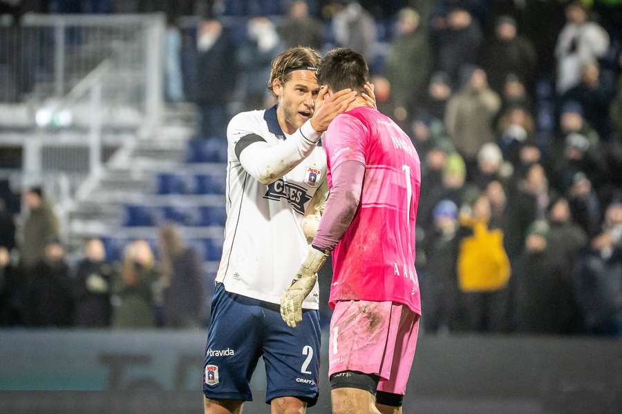 AGF's Felix Beijmo seen in celebration with goalkeeper Jesper Hansen.
