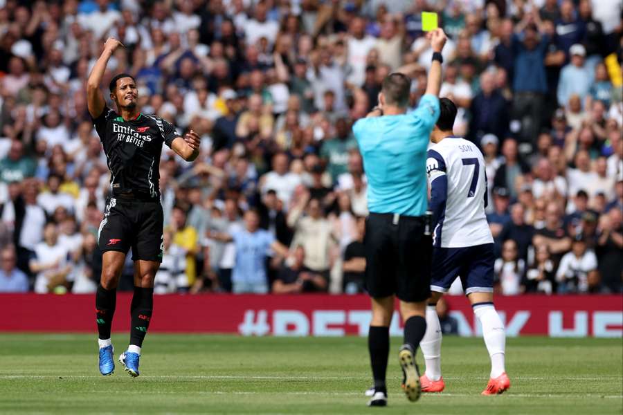 Arsenal defender William Saliba reacts after receiving a yellow card