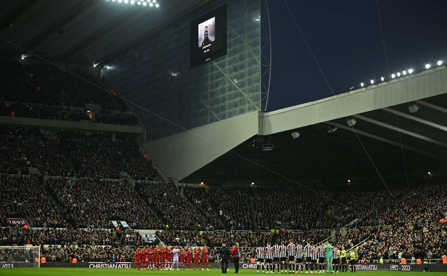 Newcastle and Liverpool players take part in a minute's applause before their Premier League match on Saturday