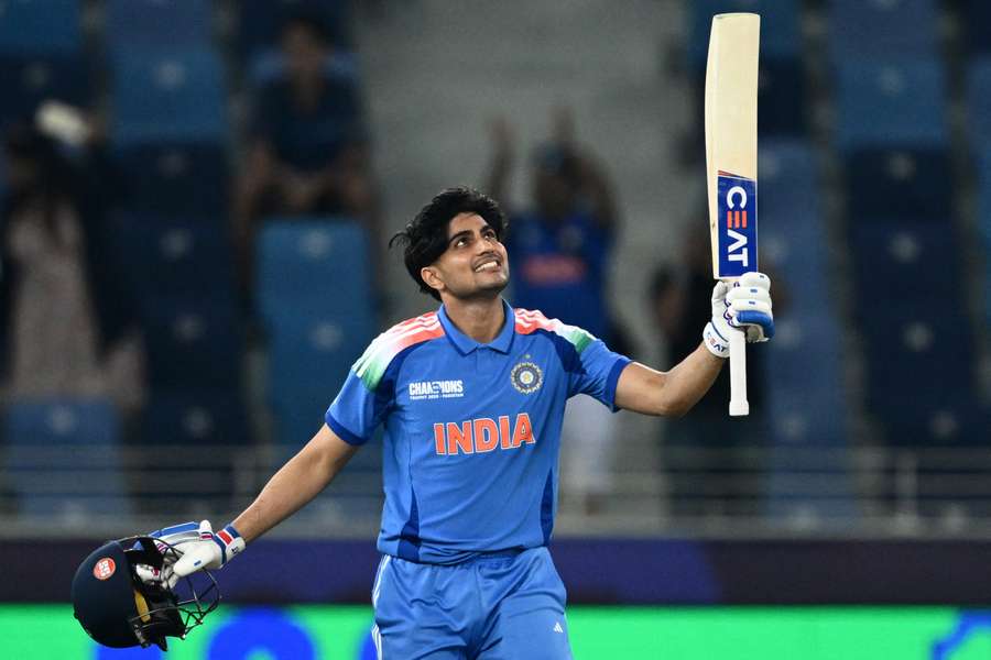 Gill acknowledges the crowd after notching his century