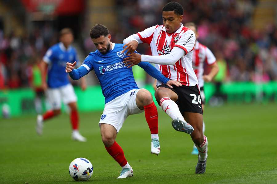 Conor Chaplin of Portsmouth battles for possession with Shea Charles of Southampton