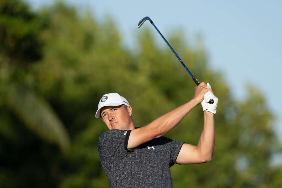 Jordan Spieth hits his tee shot on the 11th hole during the first round  