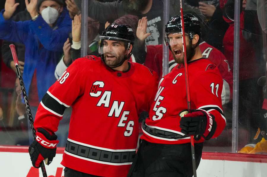 Jordan Staal and Jordan Martinook celebrate a goal