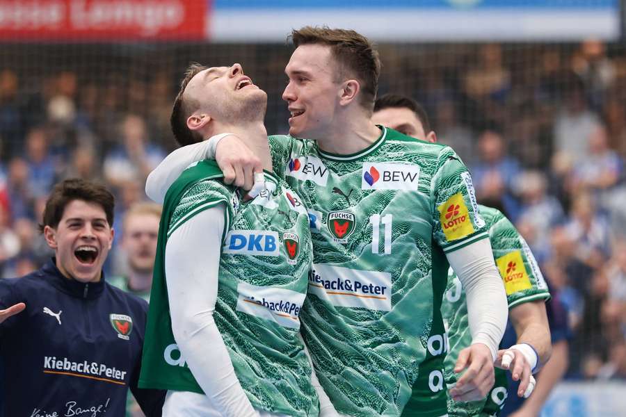 Fuchse's Lasse Andersson celebrates with Mathias Gidsel after the narrow win over TBV Lempo Lippe Fuchse's Lasse Andersson celebrates with Mathias Gidsel after the narrow win over TBV Lempo Lippe