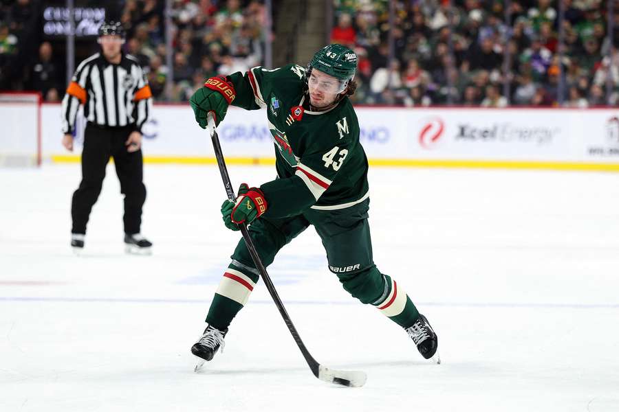 Quinn Hughes shoots the puck in his Minnesota Wild debut (2025) Quinn Hughes shoots the puck in his Minnesota Wild debut (2025)