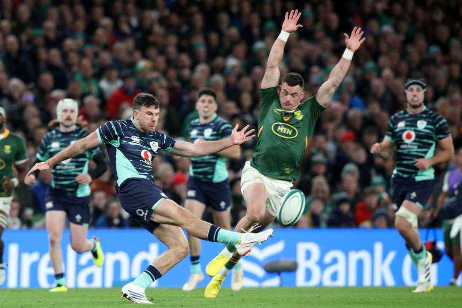 South Africa's centre Jesse Kriel attempts to charge down a kick from Ireland's full-back Hugo Keenan