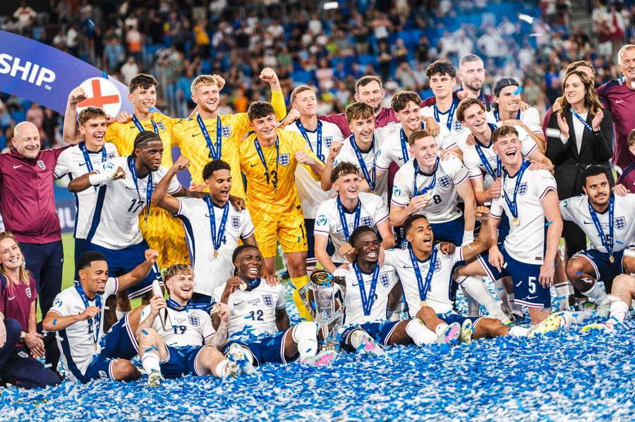 Lee Carsley's charges celebrate with the trophy following the final