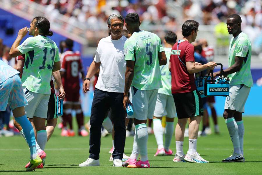Murat Yakin speaks to Manuel Akanji during a hydration break Murat Yakin speaks to Manuel Akanji during a hydration break