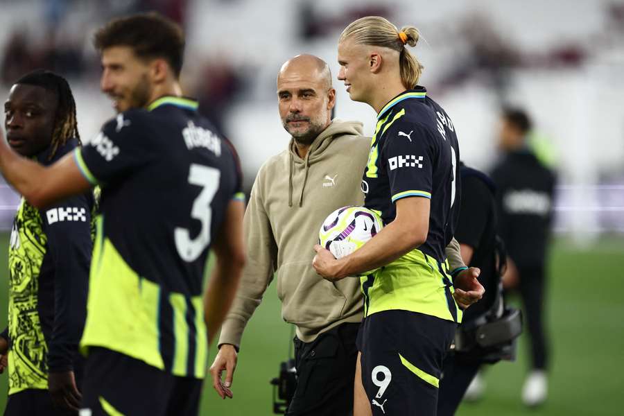 Pep Guardiola e Haaland 