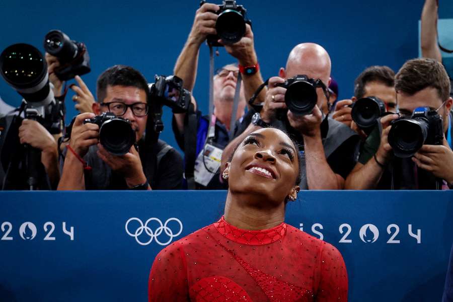 Simone Biles of United States reacts after her performance