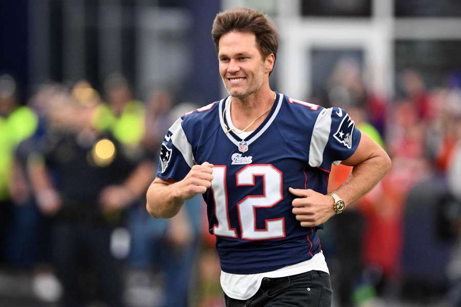 Patriots' former quarterback Tom Brady runs on the field during a halftime ceremony in his honour in September 2023