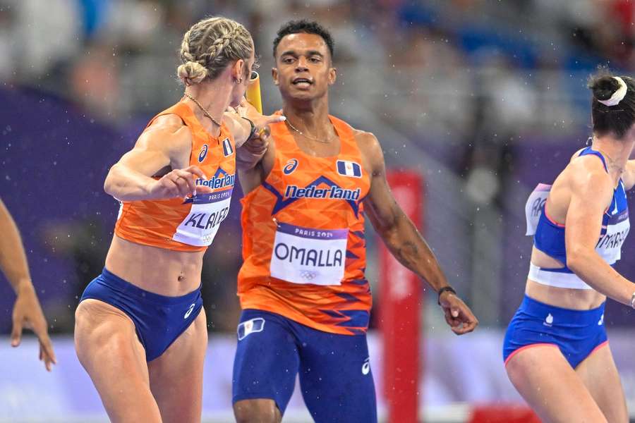 Eugene Omalla passes a bat in Lieke Klaver during the final 4x400m mixed relay in Paris, France Eugene Omalla passes a bat in Lieke Klaver during the final 4x400m mixed relay in Paris, France