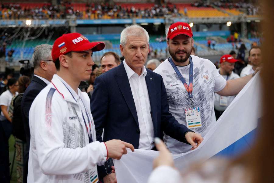 Russia sports minister Oleg Matytsin pose with athletes