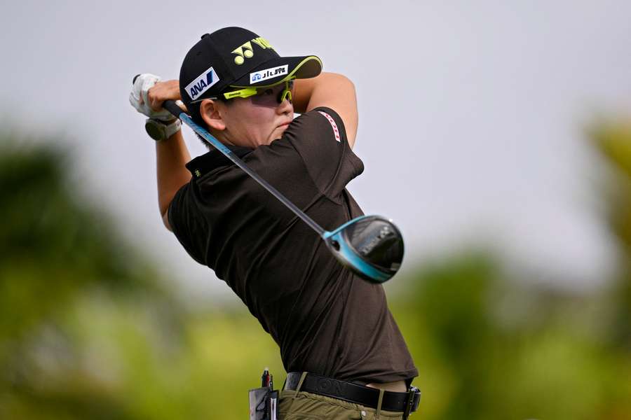 Akie Iwai of Japan plays a shot from the 17th tee during the first round of the Lotte Championship