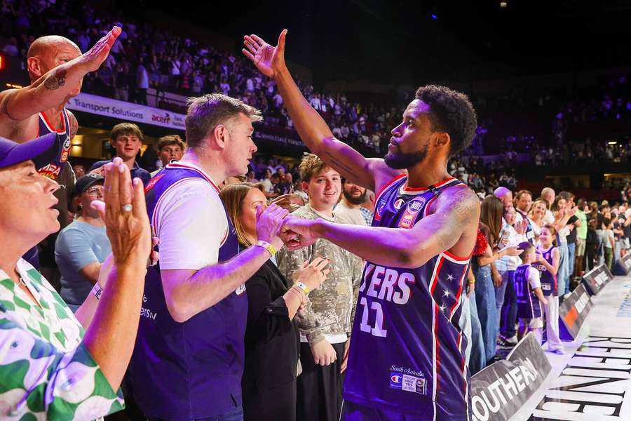 Bryce Cotton celebrates Adelaide's Game 4 victory with supporters during the recent NBL Finals.