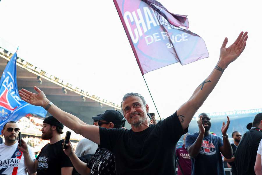 Paris Saint-Germain coach Luis Enrique celebrates after winning Ligue 1 on Saturday