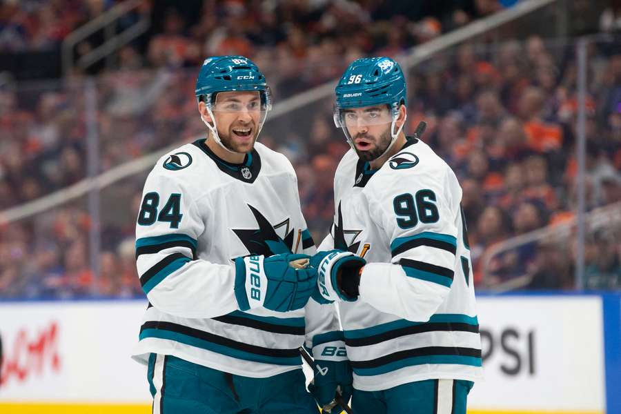 San Jose Sharks players Jan Rutta (#84) and Jake Walman (#96) celebrating after a goal