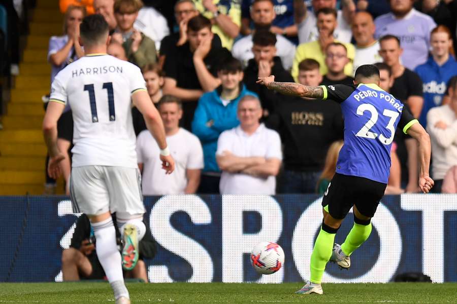 Tottenham Hotspur's Spanish defender Pedro Porro (R) shoots to score their second goal