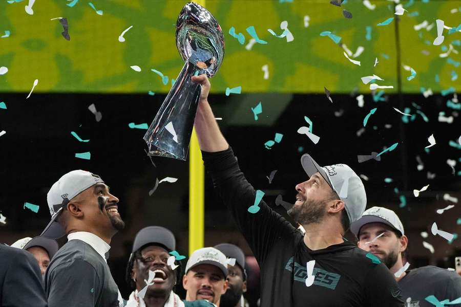 Philadelphia Eagles head coach Nick Sirianni hoisting the Lombardi Trophy after winning Super Bowl LIX
