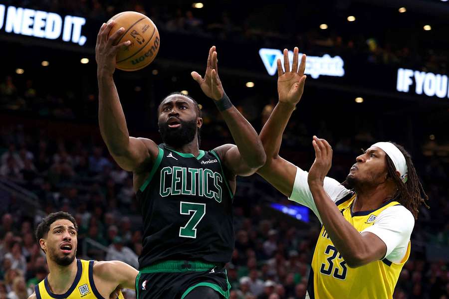 Jaylen Brown of the Boston Celtics drives to the basket past Myles Turner of the Indiana Pacers