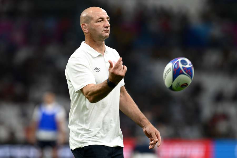 England head coach Steve Borthwick tosses a rugby ball