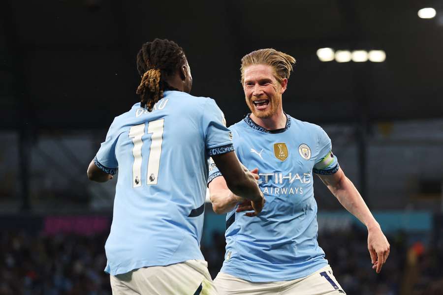 De Bruyne celebrates with fellow Belgian Doku