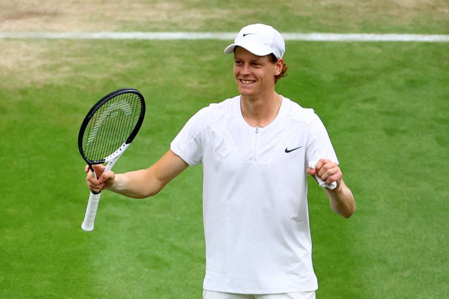 Jannik Sinner celebrates after making it into the semi-final at Wimbledon