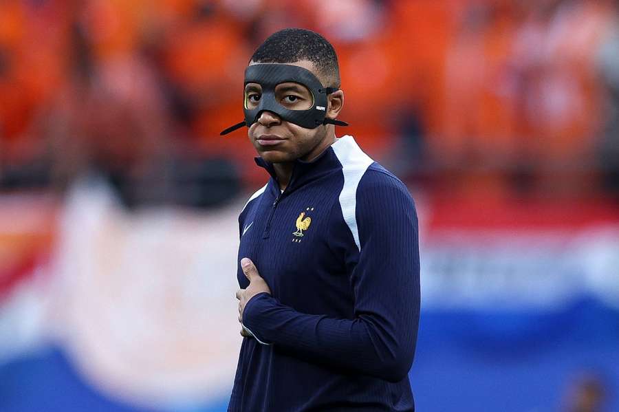 Mbappe with his mask