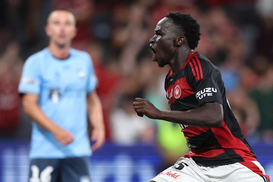 Wanderers' Alou Kuol celebrates his derby goal on Saturday night.