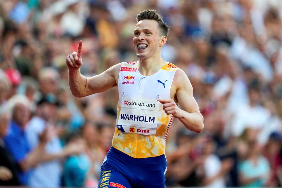 Karsten Warholm of Norway celebrates winning the men's 400m hurdles