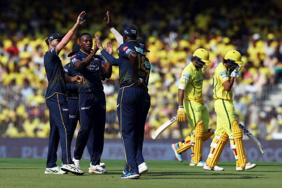 Gujarat Titans' Kagiso Rabada celebrates with teammates after taking the wicket of Chennai Super Kings' Urvil Patel